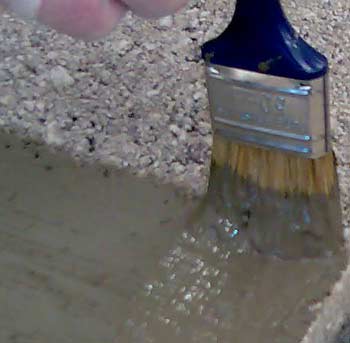 Brushing on cement based Tanking slurry